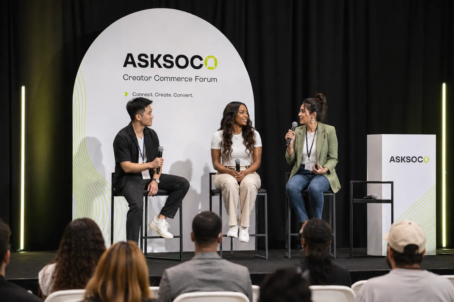 AskSoco Creator Commerce Forum panel — three speakers on stage discussing creator and live commerce.